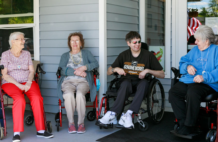 Spring Meadows residents on porch